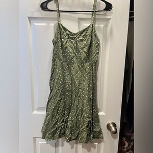 Green with white dot strapped dress.